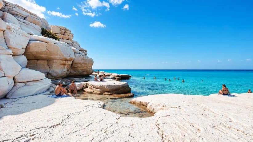 Swimmers, rocky bay